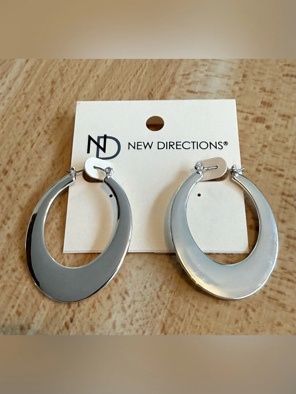 NWT. New Directions. Large Silver Oval Hoops.